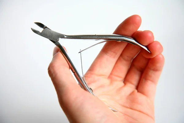 stock image Nail clippers in hand