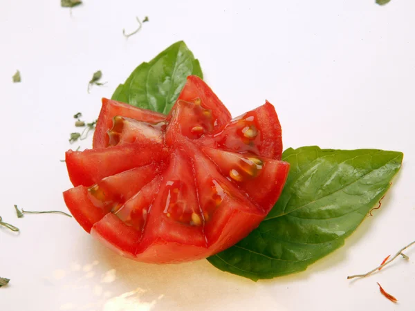 stock image Tomato flower with herbs and spices against white