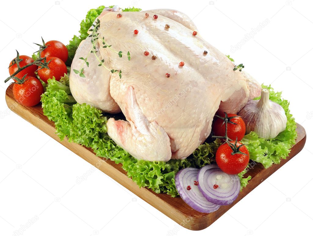 Fresh raw chicken with salade, onion, tomato and condiment isolated on white