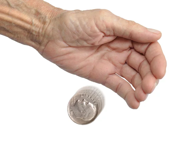 Hand and falling coins — Stock Photo, Image