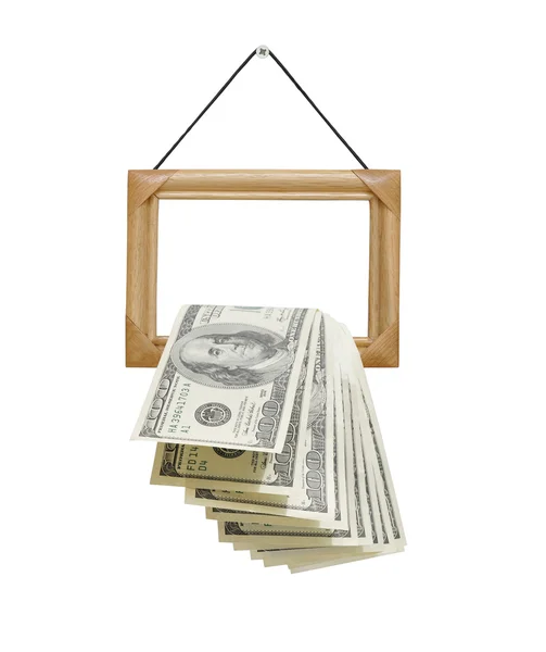 Money falling out of photo frames — Zdjęcie stockowe