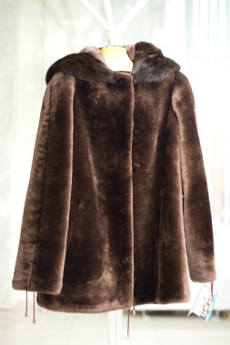 Female warm fur coat from a muton clipart