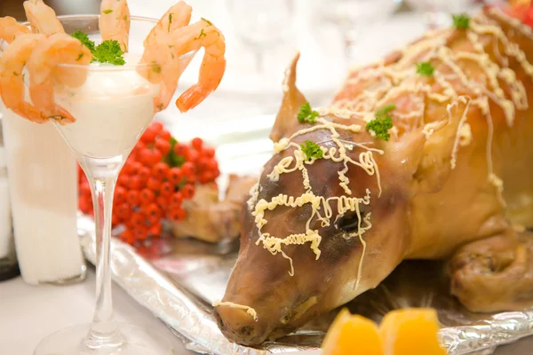 stock image Small pig baked on a festive table