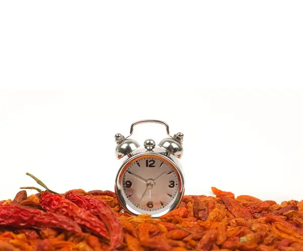 Hours against hot pepper — Stock Photo, Image