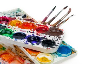 Water color paints on a white background and a brush clipart