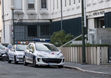 Two french police cars in the street clipart