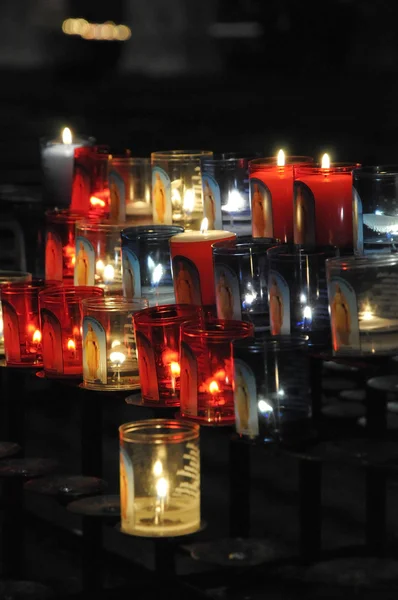 stock image Close-up on some religious candles on a black support