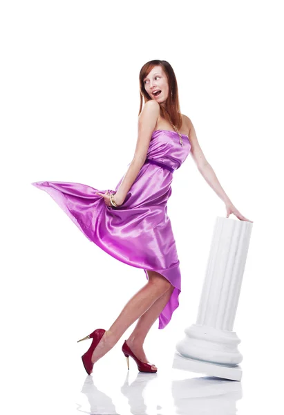 年轻美丽女性穿着淡紫色衣服 免版税图库照片