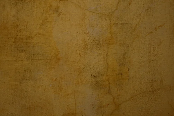 蜂蜜色の割れたプラスター壁 — ストック写真