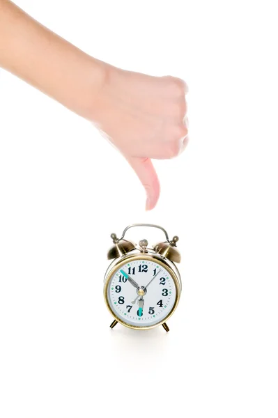Thumbs-down and alarm clock — Stock Photo, Image