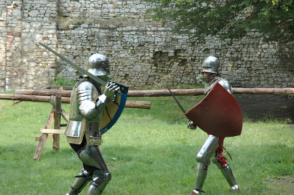 Two knights in armor fighting a duel with lances in a