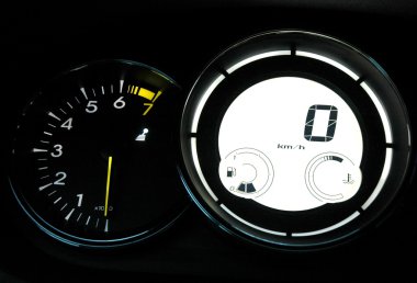 Speedometer and tachometer on dashboard clipart