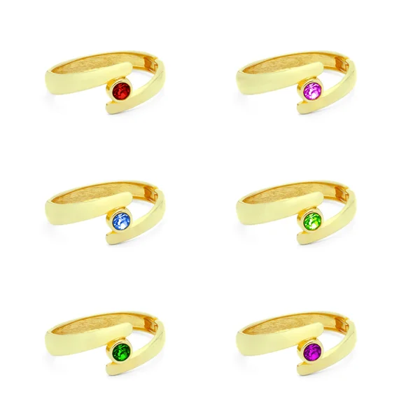 Anéis dourados com várias pedras preciosas — Fotografia de Stock