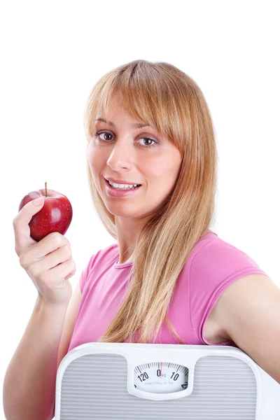 Hermosa mujer sosteniendo una escama y manzana —  Fotos de Stock