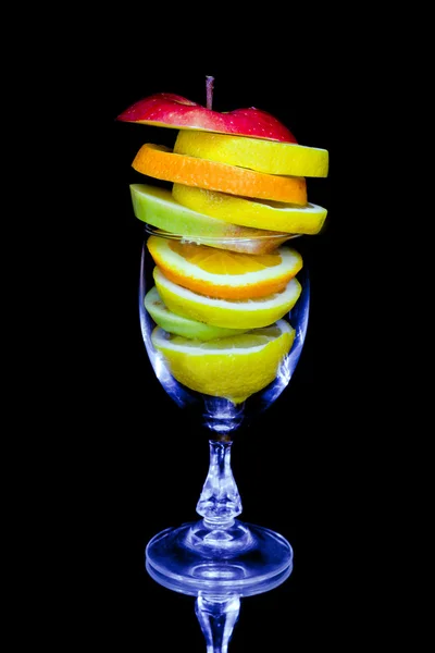 stock image Fruit cocktail composition isolated on black background