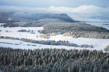 Winter Table Mountain range- landscape near small, picturesque Pasterka village in Poland. Famous tourist attraction. clipart