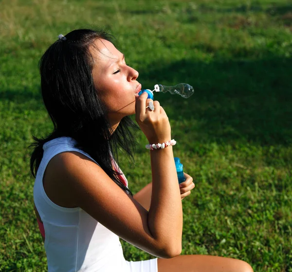 stock image Girl making soap bubbles