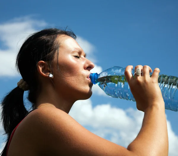 stock image Girl drinking water from a bottle