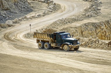 Transport trucks in the dolomite mine clipart