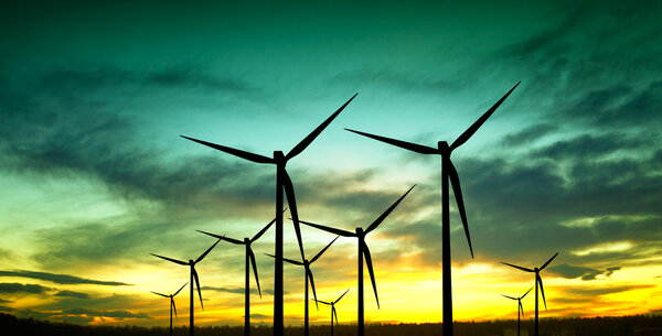 Wind turbines silhouette at sunset