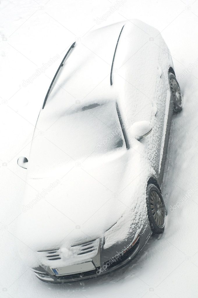 Car outside under a thick layer of snow