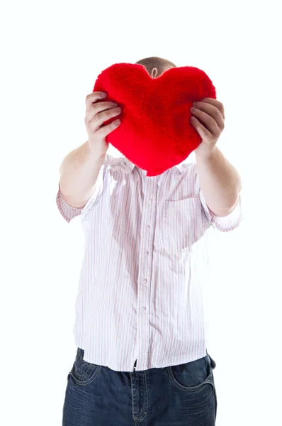 stock image Man with red plush heart on white background