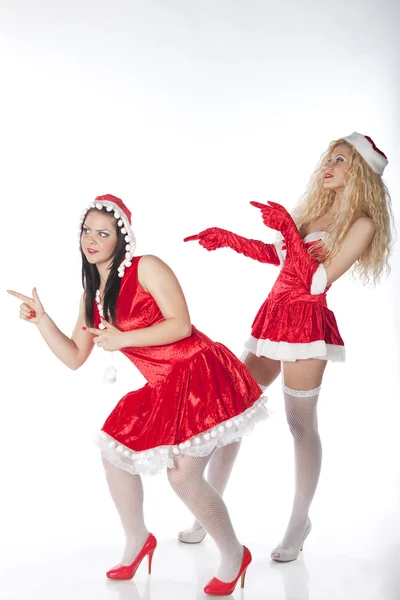 Two sexy Santa girls having fun on a Christmas party — Stock Photo, Image