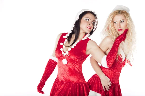 Due ragazze sexy Santa divertirsi su una festa di Natale — Foto Stock