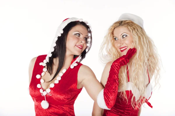 Two sexy Santa girls having fun on a Christmas party — Stock Photo, Image