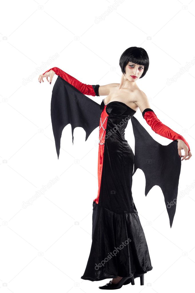 Young woman posing as vampire