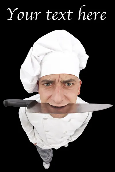 Ανόητη θυμωμένος σεφ κρατώντας ένα μαχαίρι στο στόμα του — Φωτογραφία Αρχείου