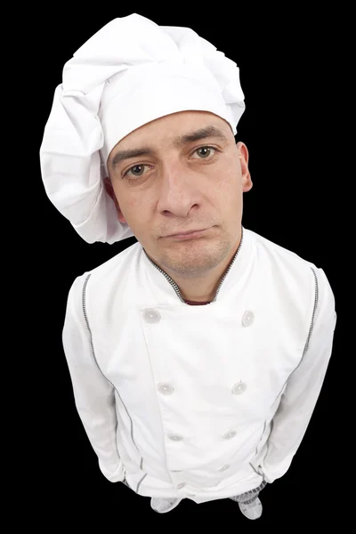 Серьезный молодой шеф-повар смотрит в камеру — стоковое фото