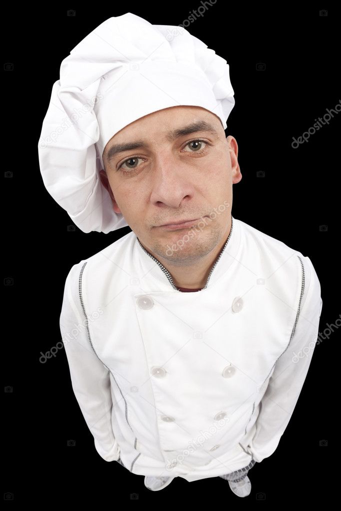 Serious young chef looking at camera