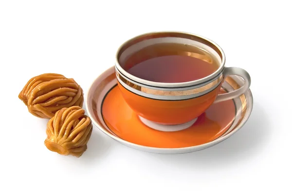 Tea in an orange cup with nath — Stock Photo, Image
