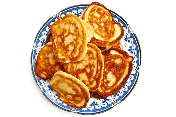 Golden pancakes on a plate — Stock Photo, Image