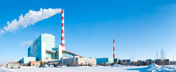 The image of power station against a winter landscape