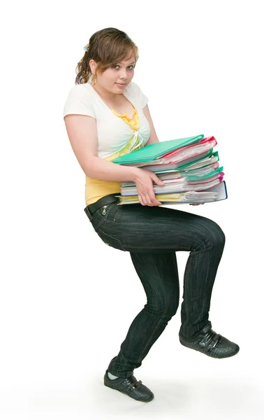 Woman holding heavy files on white — Stock Photo, Image
