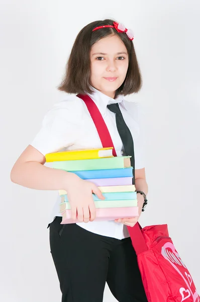 De schoolmeisje met een rode zak — Stockfoto
