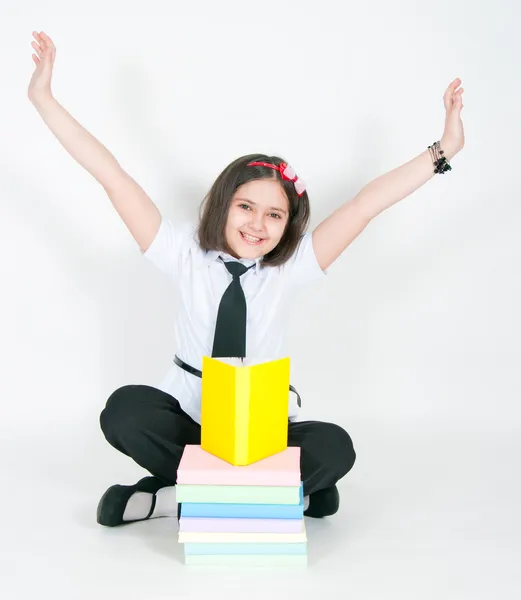 De vreugdevolle meisje en leerboeken — Stockfoto