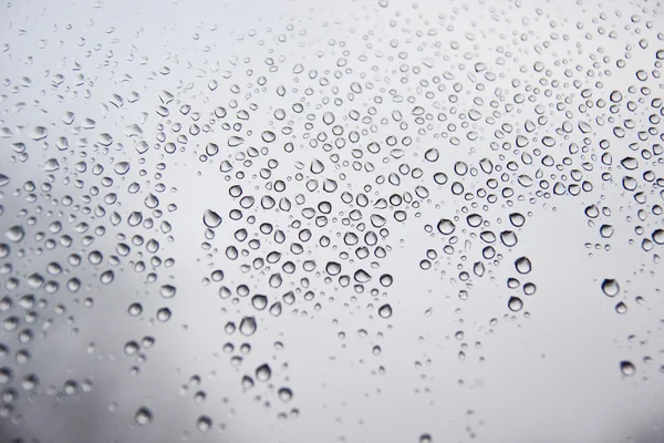 stock image Water droplets on the glass