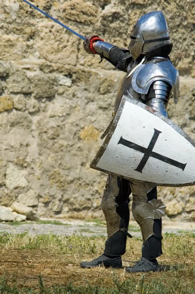 Medieval european knight near citadel wall — Stock Photo, Image
