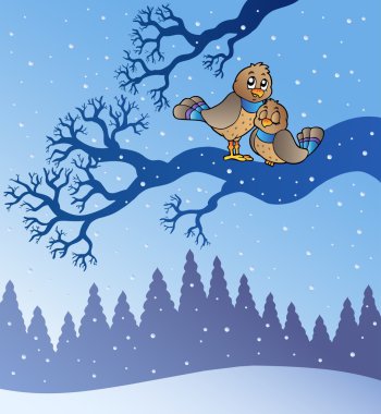 Two cute birds in snowy landscape clipart