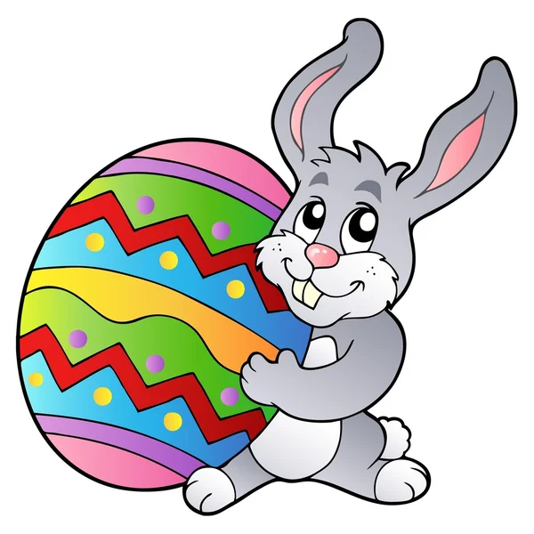 Tecknad kanin som håller påskägg — Stock vektor