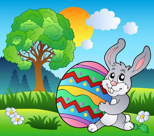 Prado con árbol y conejo de Pascua — Vector de stock