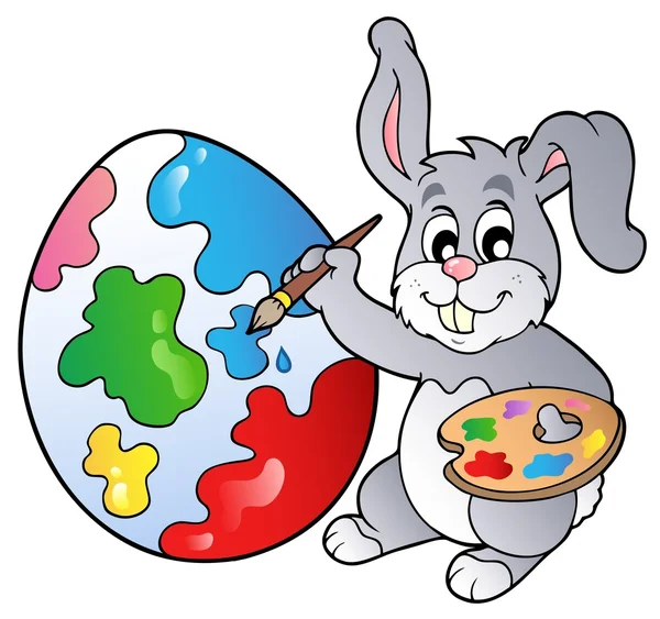 Bunny artist painting Easter egg — Stock Vector