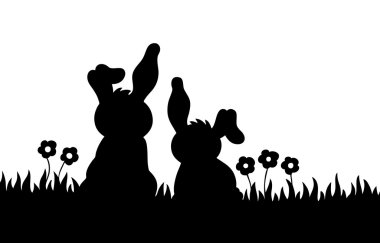 Silhouette of two rabbits on meadow clipart