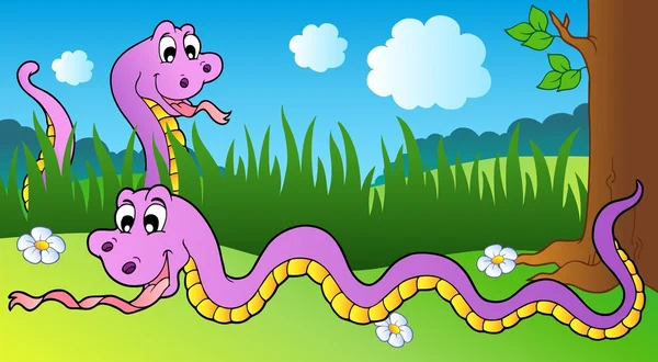 Due serpenti dei cartoni animati sul prato — Vettoriale Stock