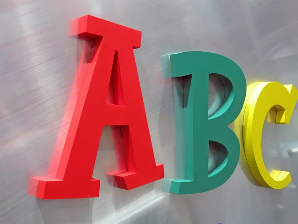 stock image Color alphabet letters on silver metal, education