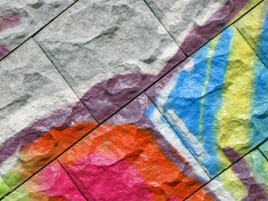 Abstract color graffiti, painted stone background closeup clipart