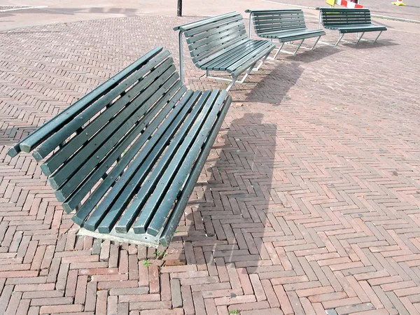 Few street bench on red brick, rest objects — Stock Photo, Image